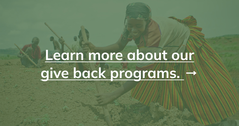 photo of woman planting tree with text reading "learn more about our give back programs"