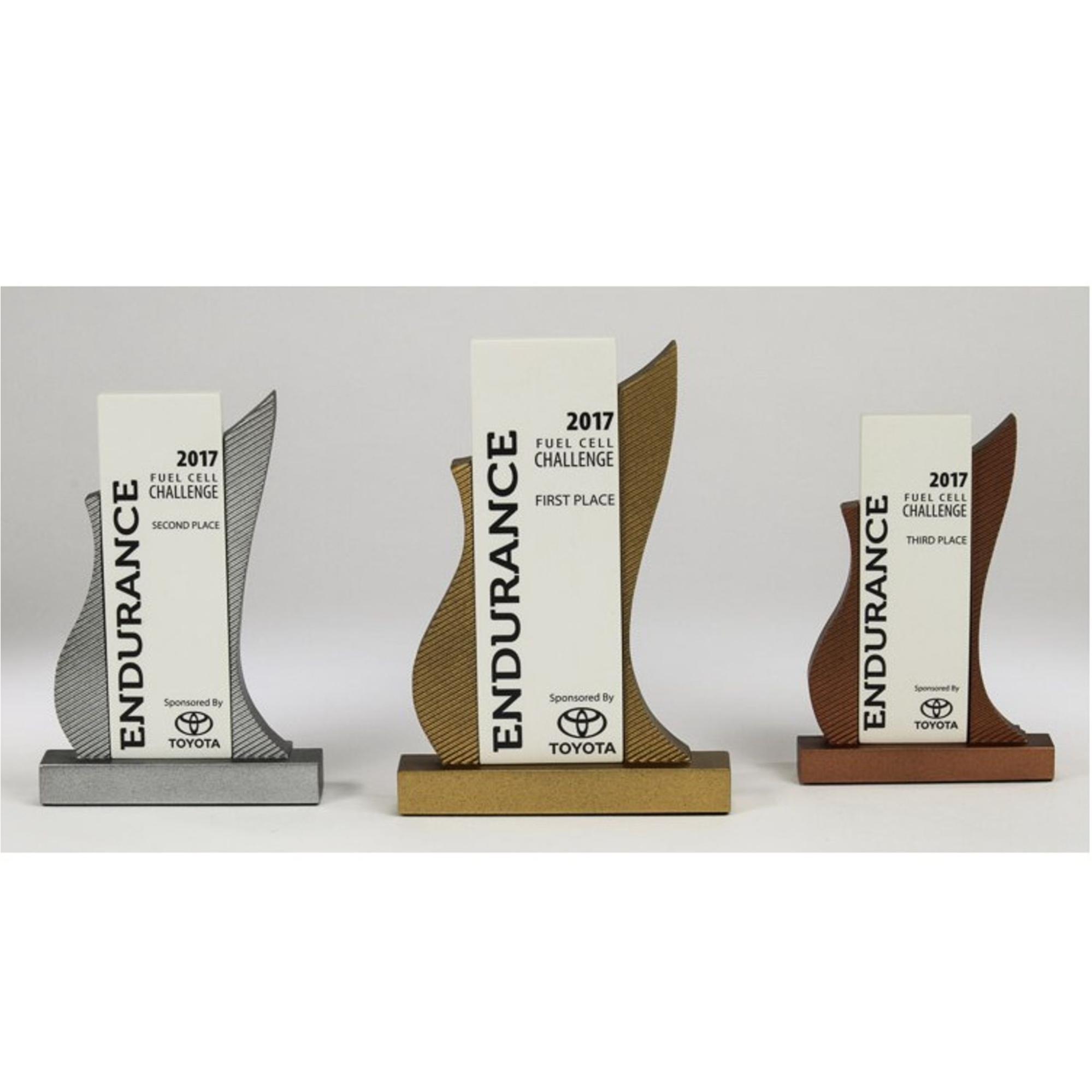 three custom awards with toyota branding, graduation swag