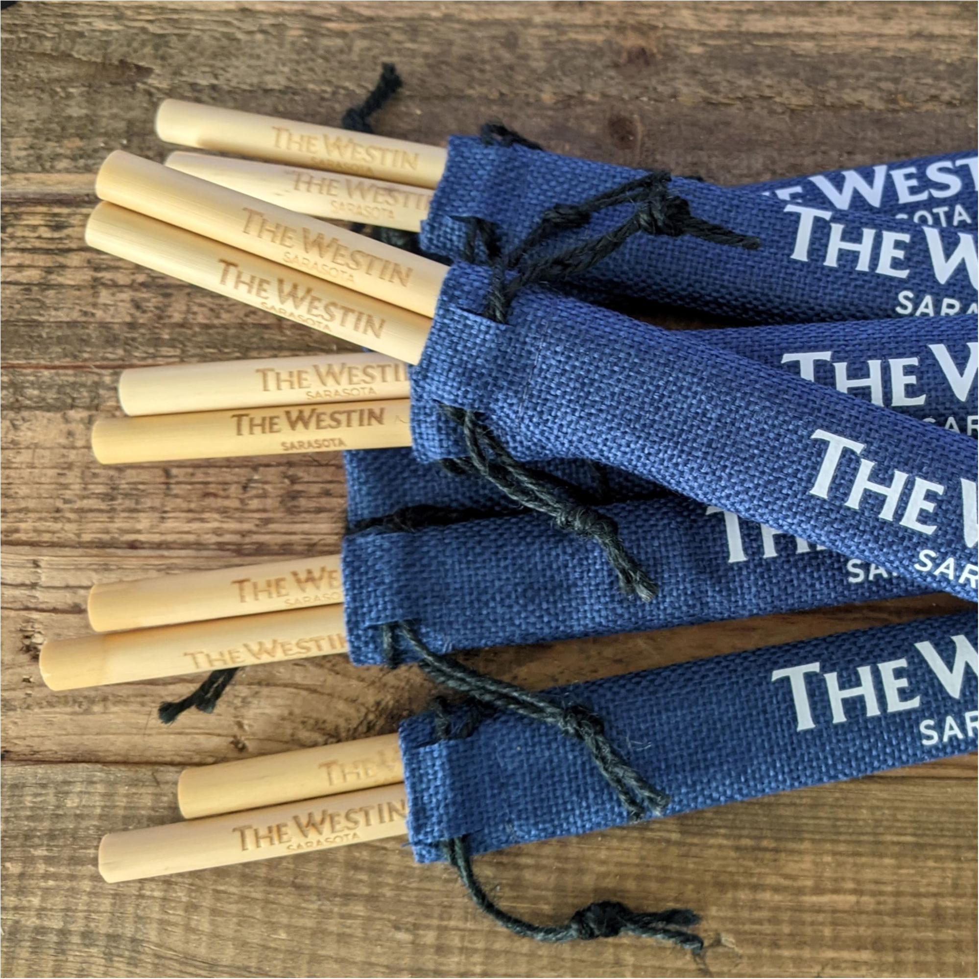 custom engraved reed drinking straws in branded blue jute pouches