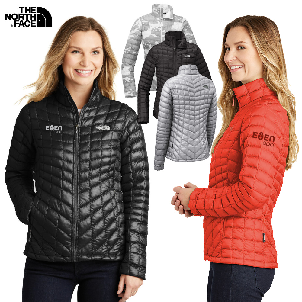 female model wearing The North Face® ladies thermal packable jacket in black and red