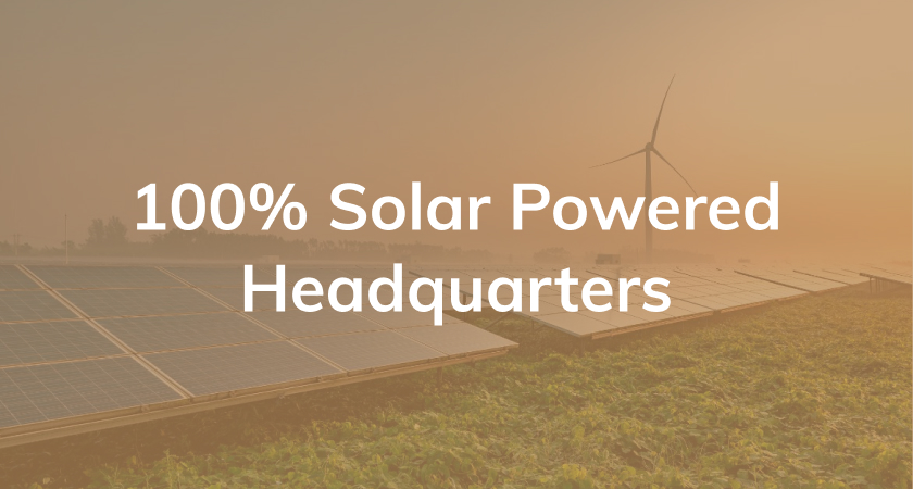 Tan background with text reading "100% solar powered headquarters"