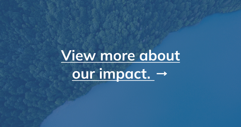 photo of trees and ocean with text reading "view more about our impact"